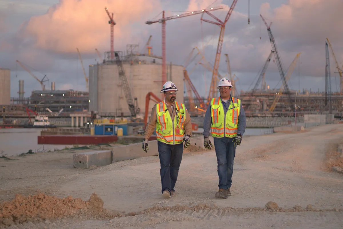 Liquefied natural gas (LNG) processing facility with storage tanks and industrial infrastructure